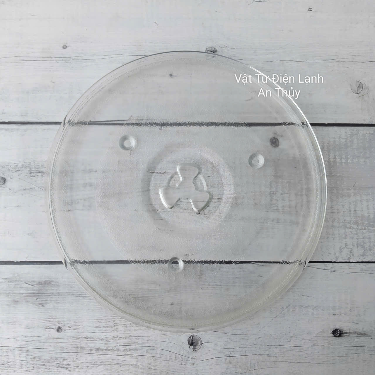 Đĩa thuỷ tinh lò vi sóng đường kính 27cm có vấu Đĩa thuỷ tinh lò vi sóng đường kính 27cm có vấu