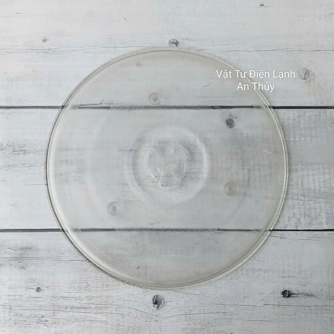 Đĩa thuỷ tinh lò vi sóng đường kính 27cm có vấu Đĩa thuỷ tinh lò vi sóng đường kính 27cm có vấu