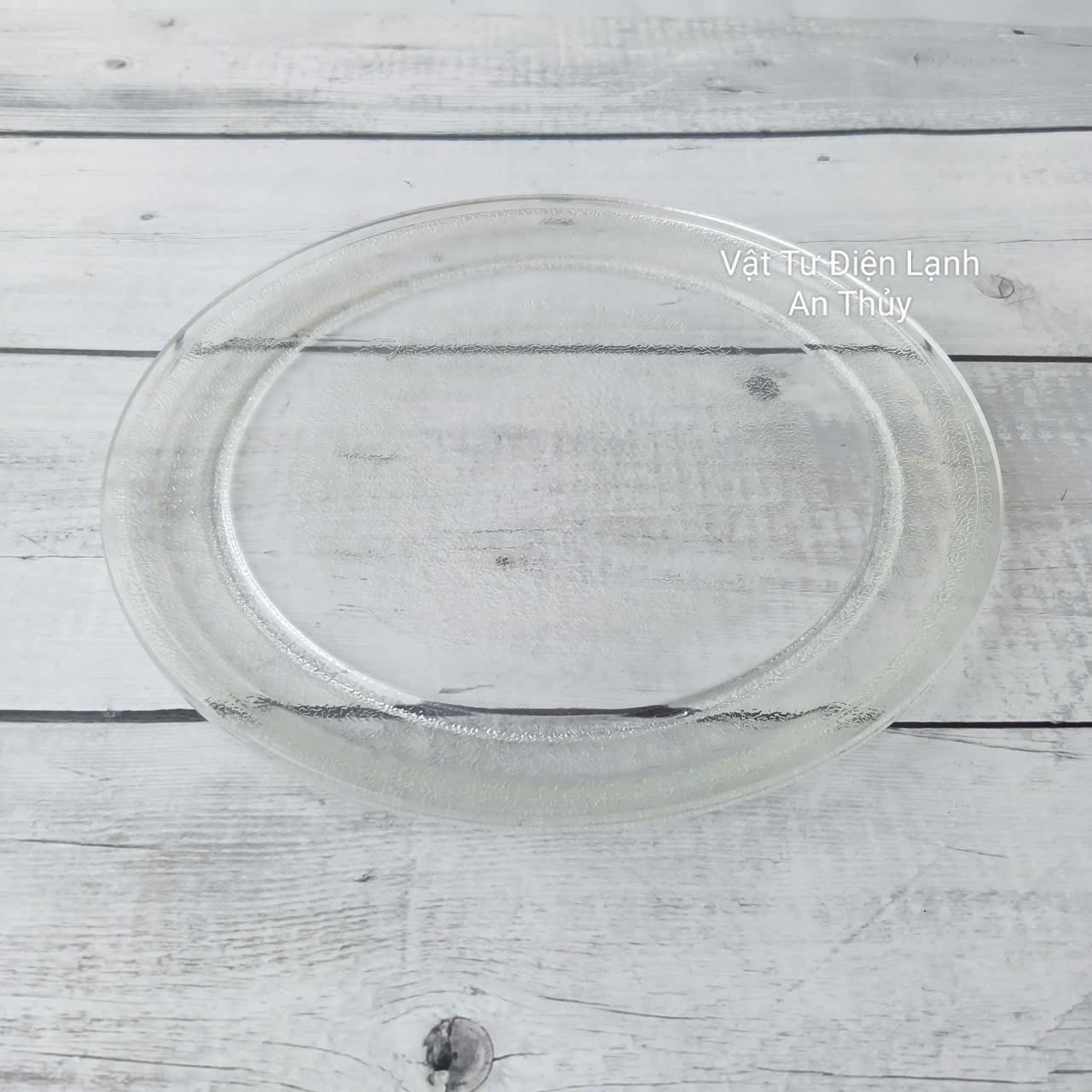 Đĩa thuỷ tinh lò vi sóng đường kính 24.5cm loại không vấu Đĩa thuỷ tinh lò vi sóng đường kính 24.5cm loại không vấu